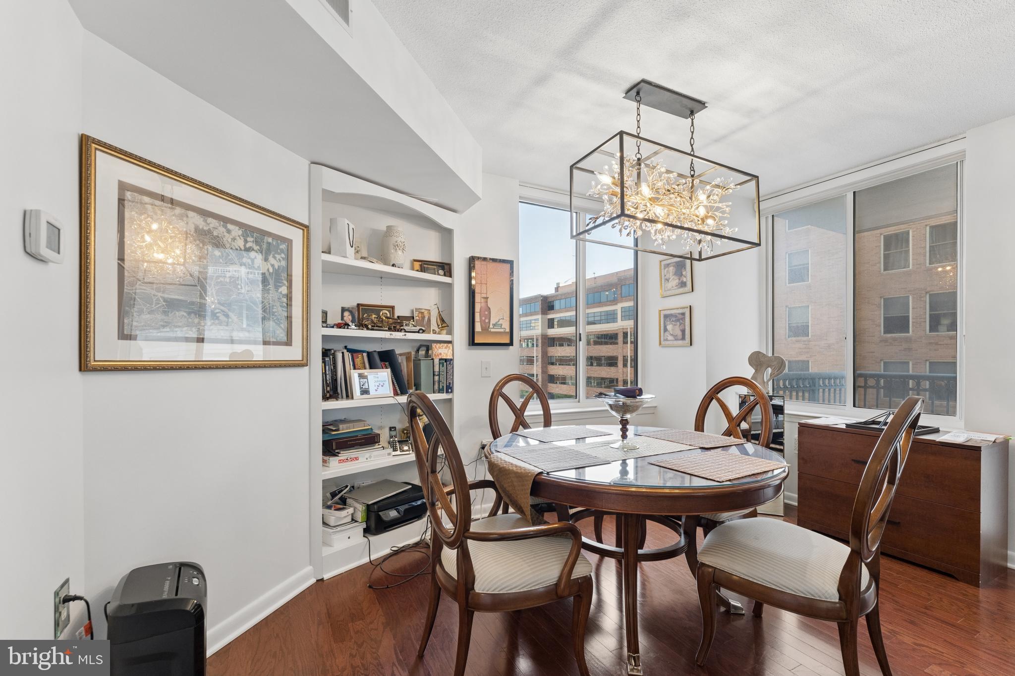 851 North Glebe Road, Unit 706 Arlington, VA 22203 - Photo 10 of 34 a view of a dining room with furniture and chandelier