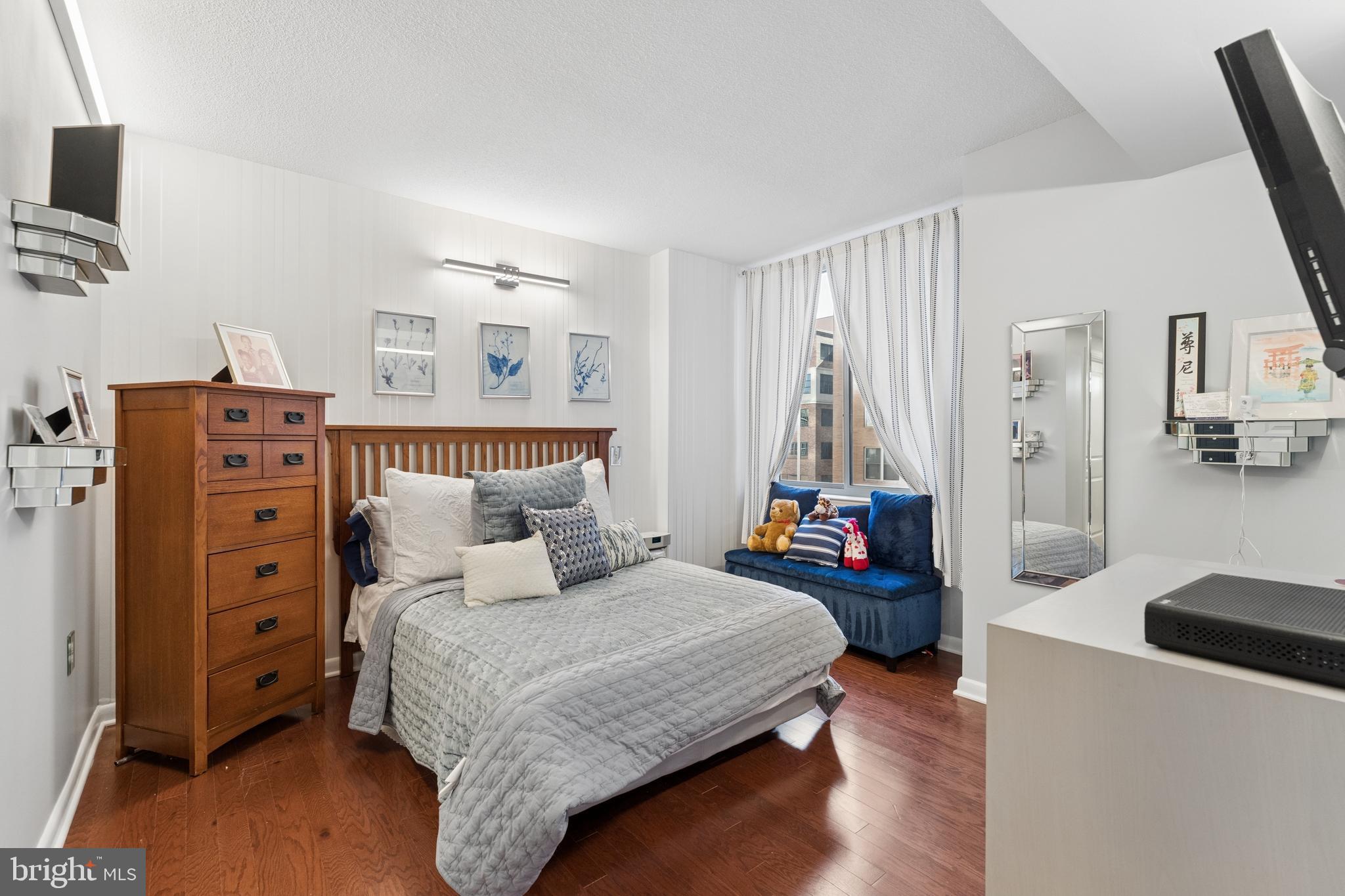 851 North Glebe Road, Unit 706 Arlington, VA 22203 - Photo 16 of 34 a bedroom with a bed and a television