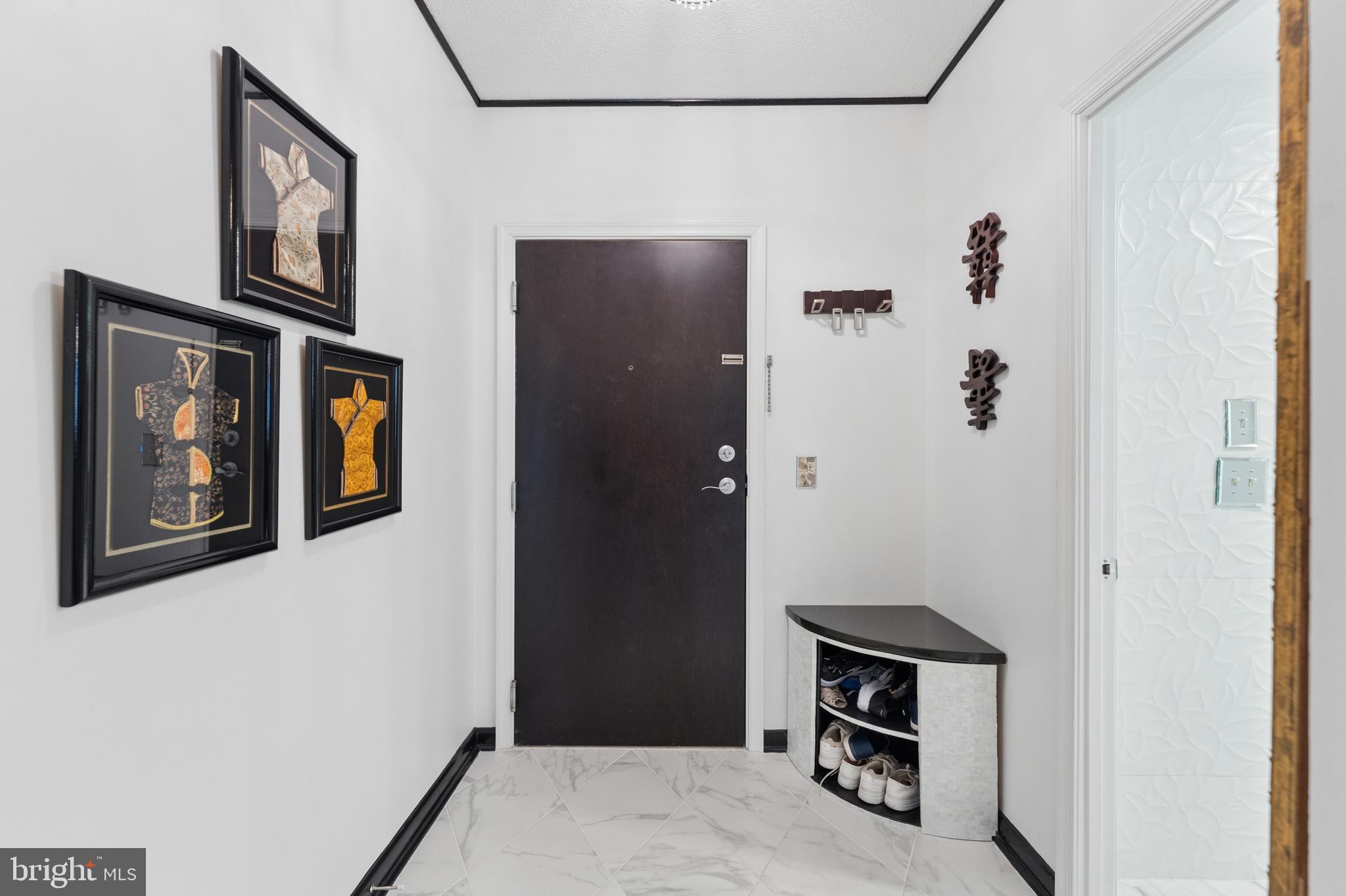 851 North Glebe Road, Unit 706 Arlington, VA 22203 - Photo 5 of 34 a view of a hallway with wooden floor and closet