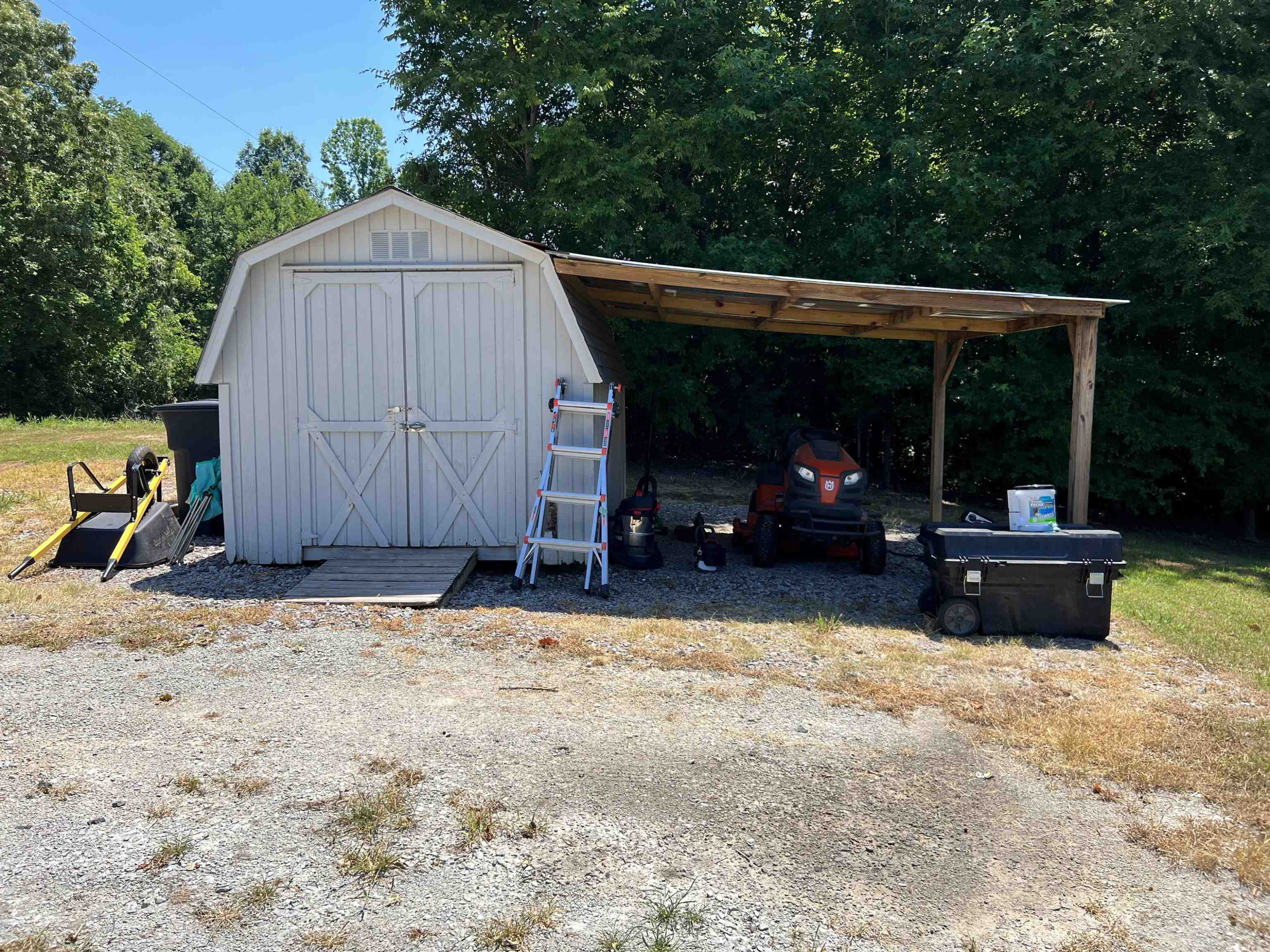 2390 Plainview Road Henderson, TN 38340 - Photo 5 of 5 a view of back yard of the house with cars parked