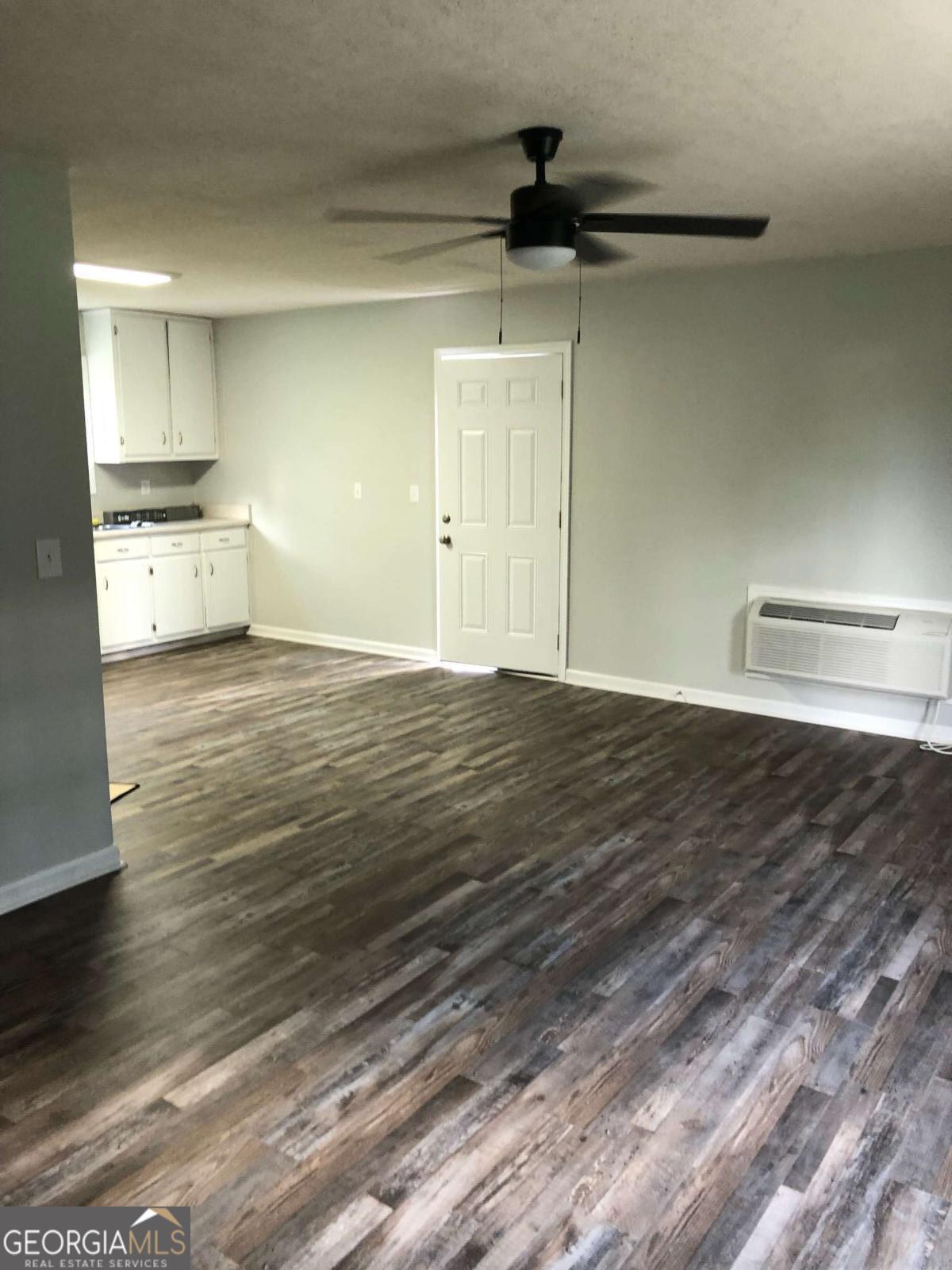 153 A Cox Road Gordon, GA 31031 - Photo 14 of 16 a view of a kitchen with a sink and wooden floor