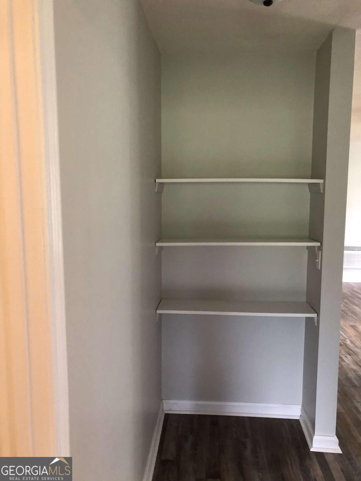 153 A Cox Road Gordon, GA 31031 - Photo 16 of 16 a view of walk in closet with empty racks