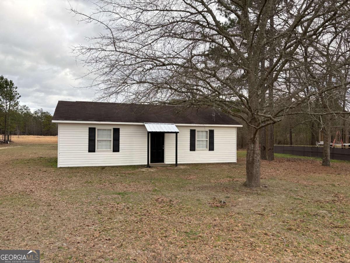 153 A Cox Road Gordon, GA 31031 - Photo 3 of 16 a house that has a tree in front of it