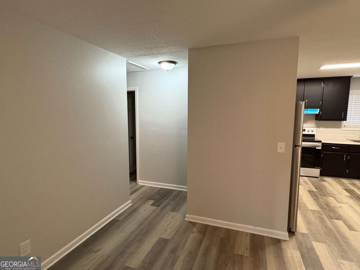 153 A Cox Road Gordon, GA 31031 - Photo 5 of 16 a view of a kitchen from the hallway