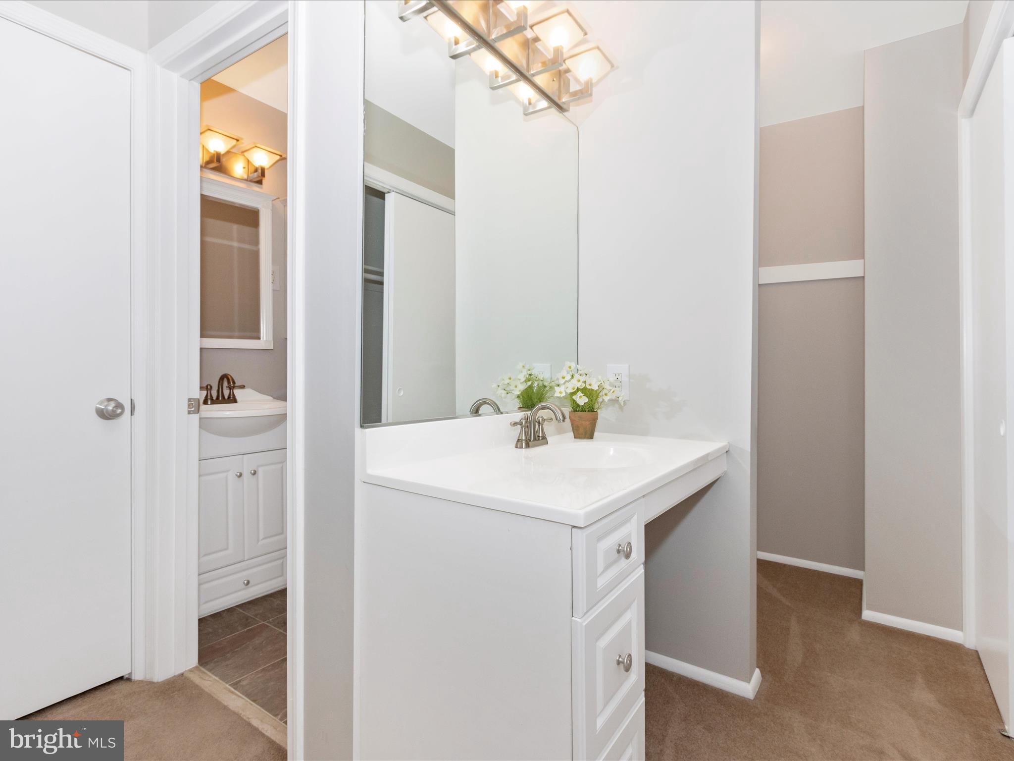 19453 Olney Mill Road Olney, MD 20832 - Photo 16 of 41 a bathroom with a sink a vanity and a mirror