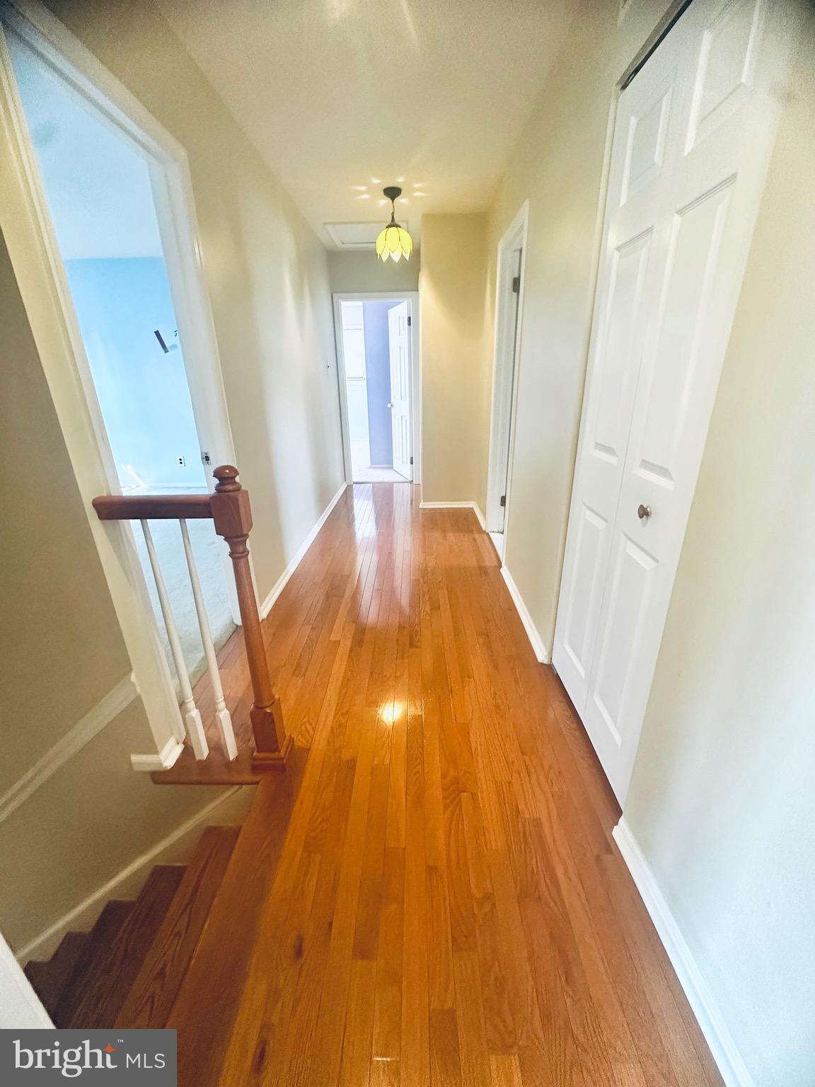 106 Hooton Road Mount Laurel, NJ 08054 - Photo 13 of 24 a view of a hallway with wooden floor and staircase