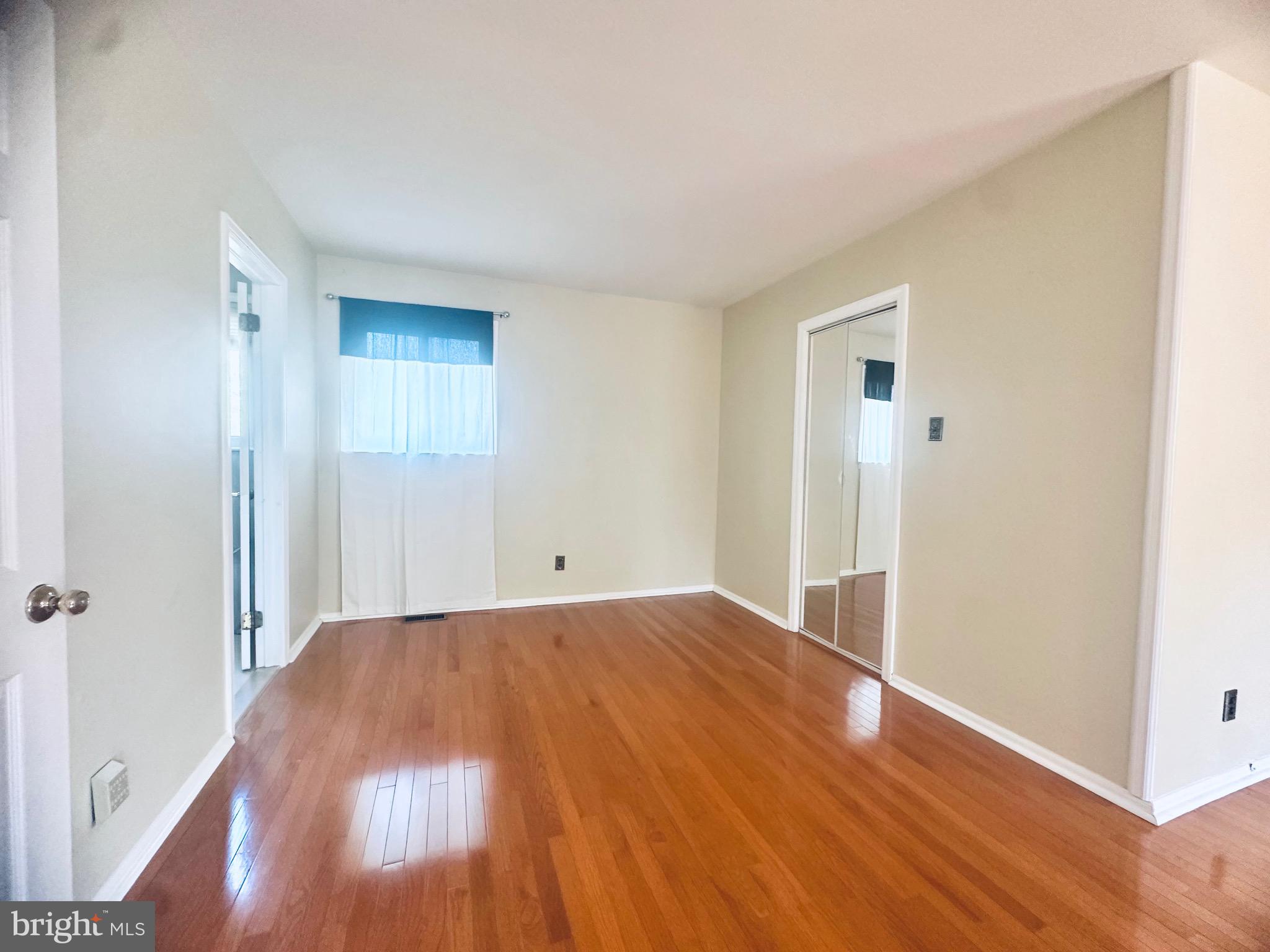 106 Hooton Road Mount Laurel, NJ 08054 - Photo 14 of 24 a view of a room with wooden floor and a window