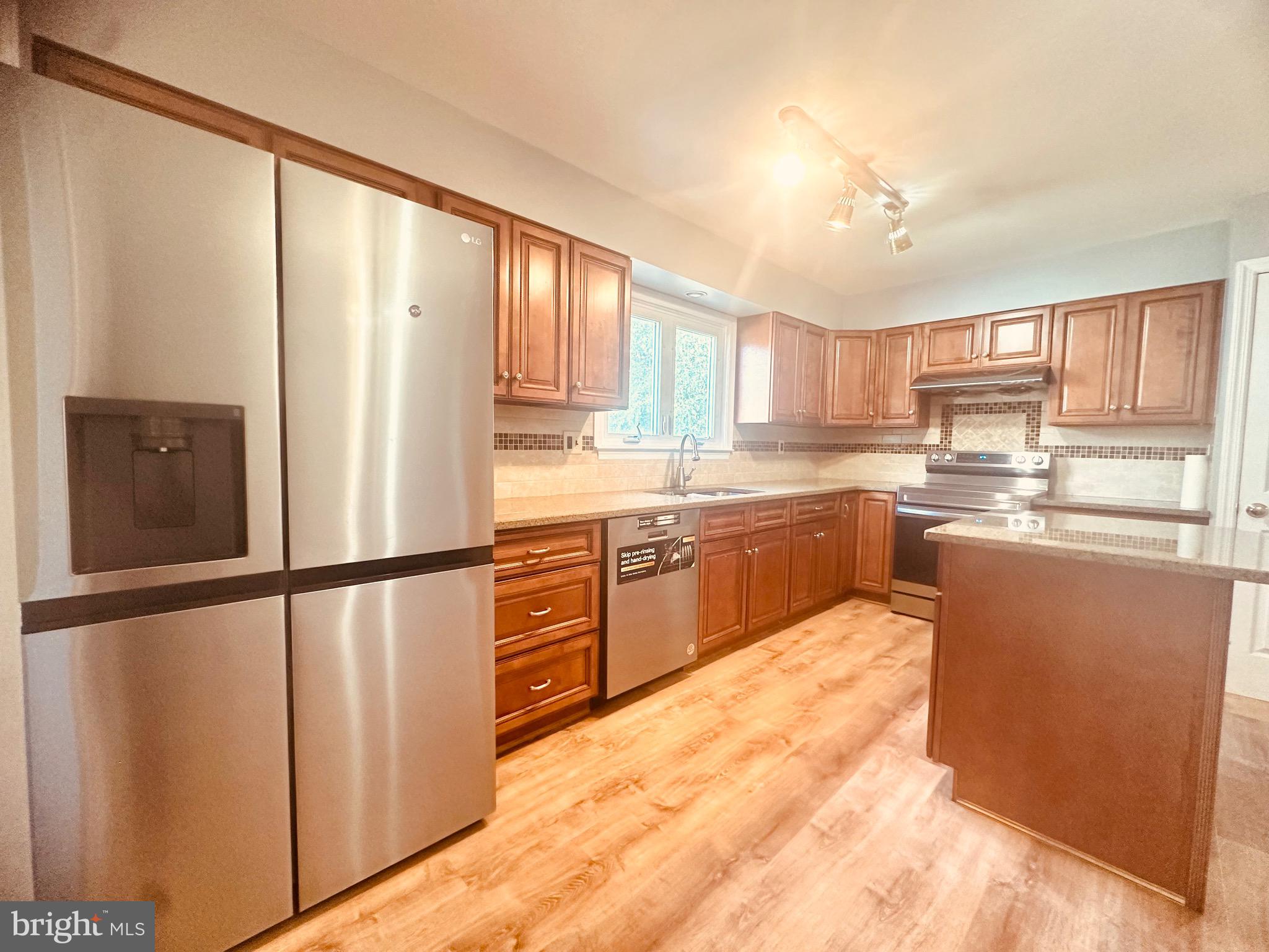 106 Hooton Road Mount Laurel, NJ 08054 - Photo 7 of 24 a kitchen with stainless steel appliances granite countertop a refrigerator sink and cabinets