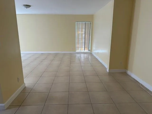 a bathroom with a sink and bathtub with toilet