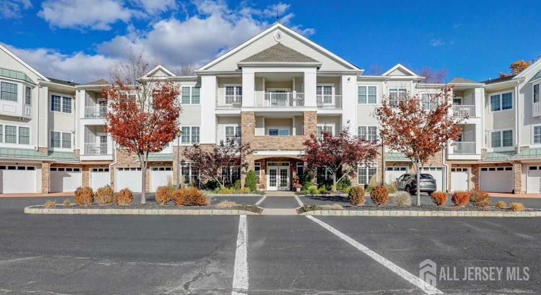 a front view of a building with a yard