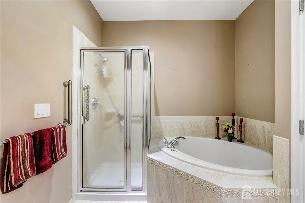 3205 Falston Circle Old Bridge, NJ 08857 - Photo 15 of 44 a bathroom with a bathtub and a shower