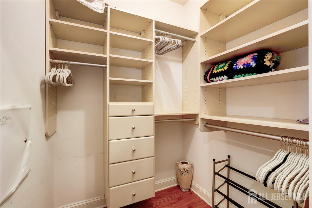 3205 Falston Circle Old Bridge, NJ 08857 - Photo 17 of 44 a view of walk in closet with clothes and shoes