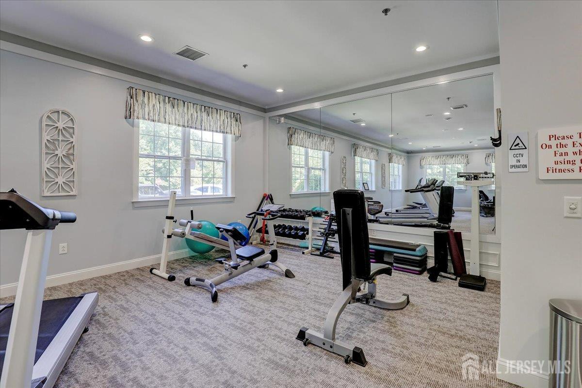 3205 Falston Circle Old Bridge, NJ 08857 - Photo 30 of 44 a living room with furniture gym equipment and a window