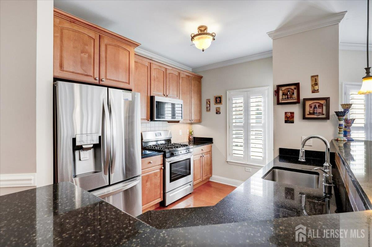 3205 Falston Circle Old Bridge, NJ 08857 - Photo 4 of 44 a kitchen with stainless steel appliances granite countertop a refrigerator stove and sink