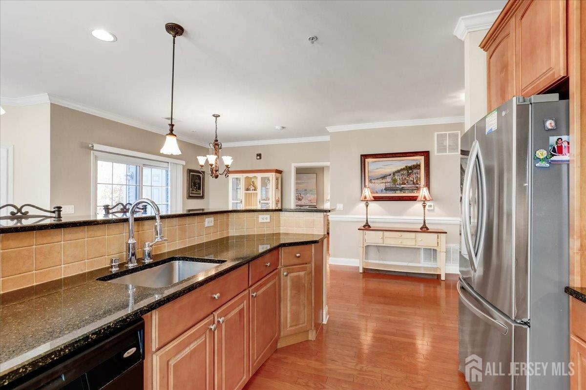 3205 Falston Circle Old Bridge, NJ 08857 - Photo 5 of 44 a kitchen with granite countertop a sink and a refrigerator