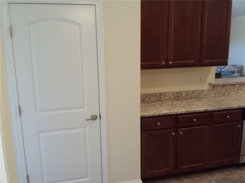 88397 Maybourne Road Yulee, FL 32097 - Photo 28 of 35 a view of a kitchen with granite countertop cabinets and a sink