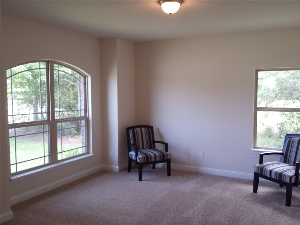 88397 Maybourne Road Yulee, FL 32097 - Photo 7 of 35 a view of a room with furniture and a window