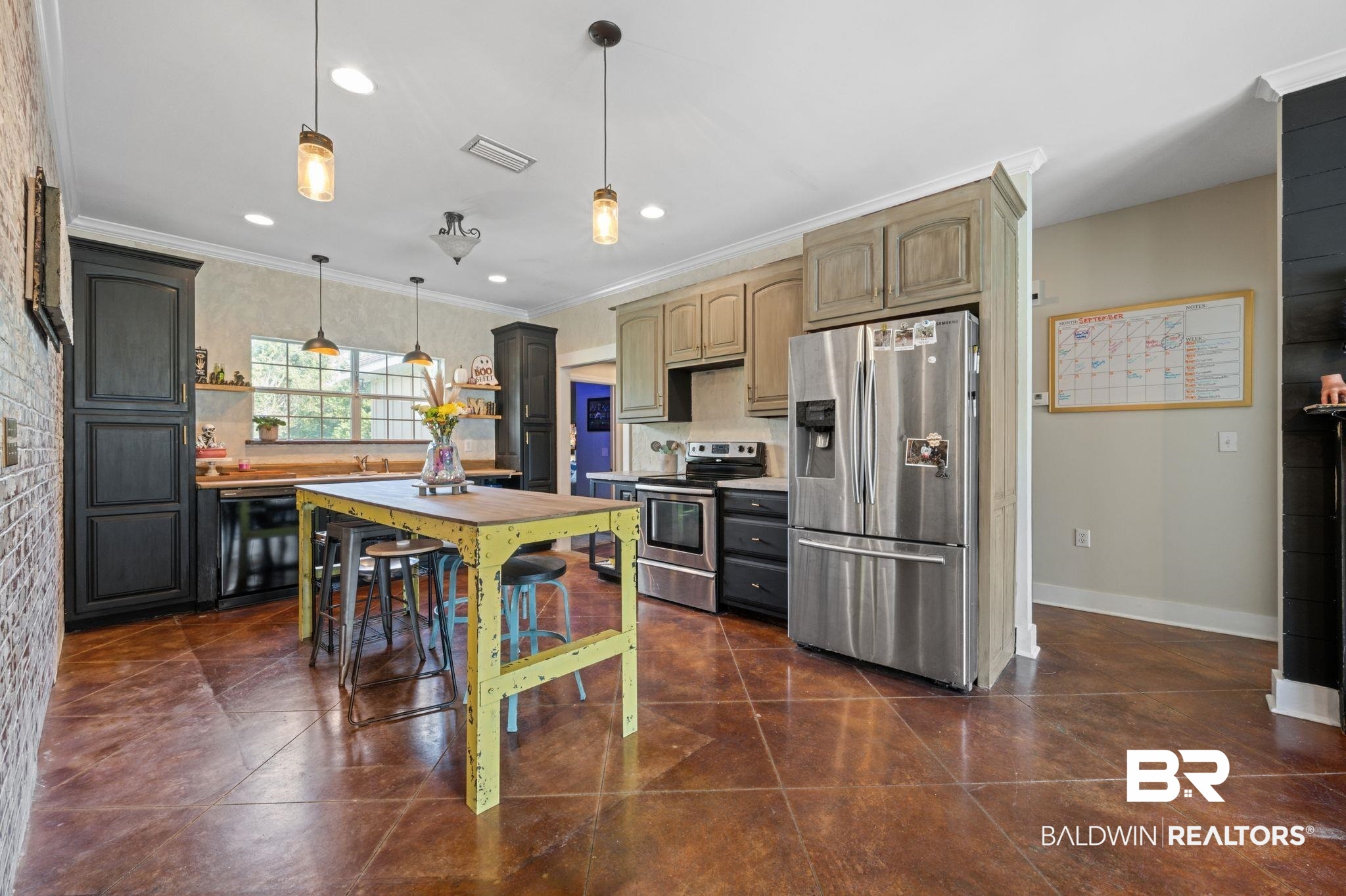 15635 North A N Brady Road Bay Minette, AL 36507 - Photo 15 of 51 Kitchen with dark tile patterned flooring, ornamental molding, pendant lighting, and stainless steel appliances