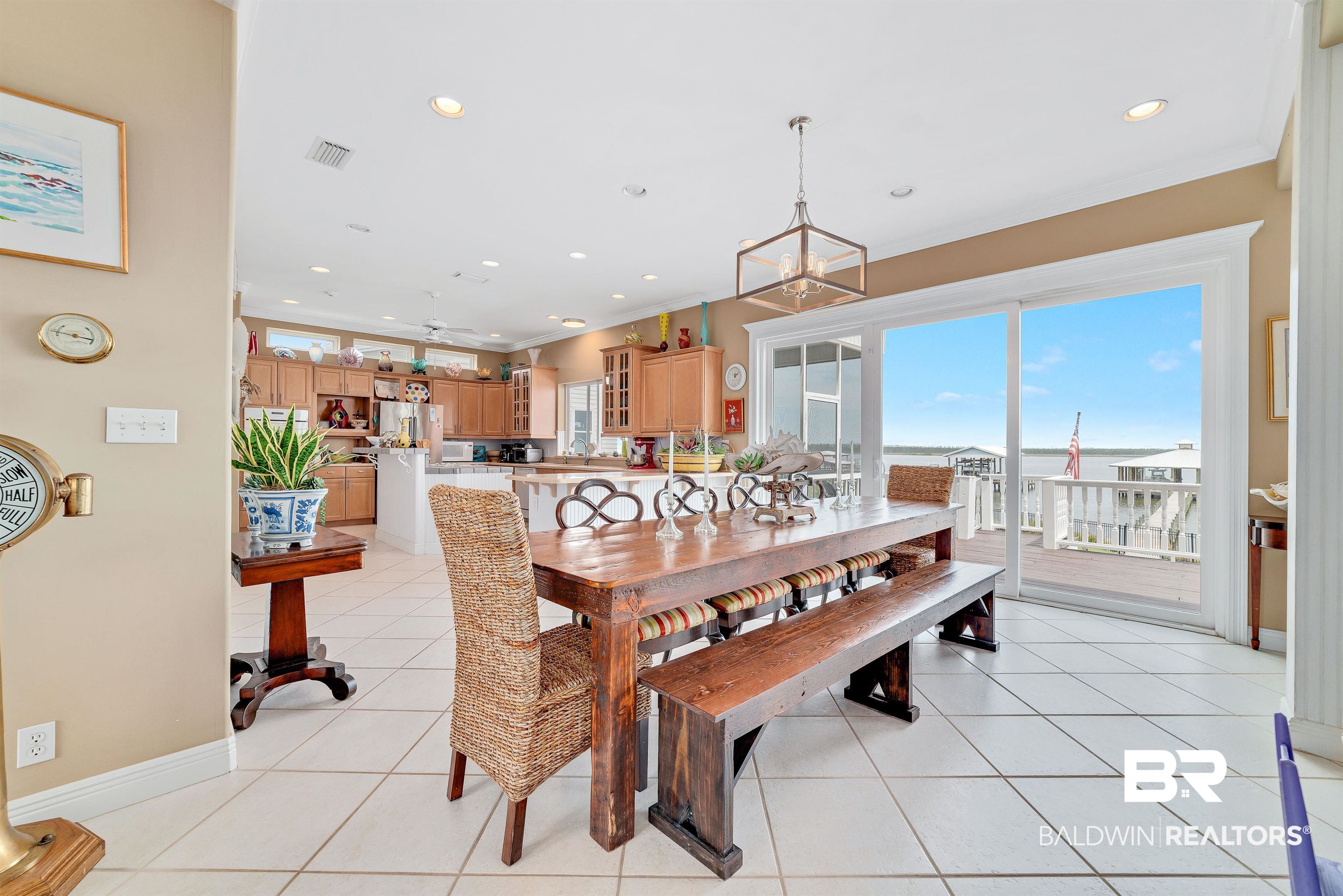 24513 Gulf Bay Road Orange Beach, AL 36561 - Photo 8 of 52 Tiled dining area with a chandelier