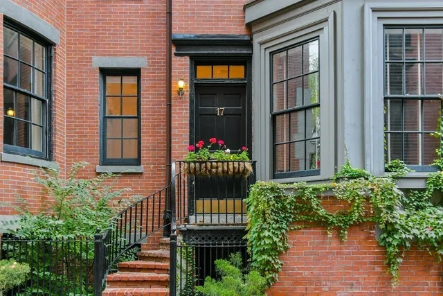 a flower garden is sitting in front of a building