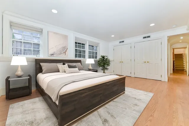 a bedroom with bed and window