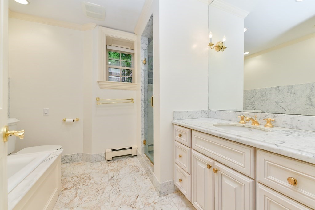 17 Willow Street, Unit 1 Boston, MA 02108 - Photo 20 of 35 a bathroom with a sink and a mirror