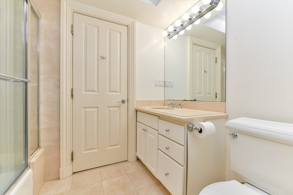 17 Willow Street, Unit 1 Boston, MA 02108 - Photo 26 of 35 a bathroom with a sink vanity mirror and toilet