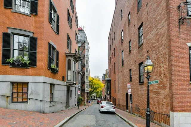 a view of a brick buildings with entryway doors