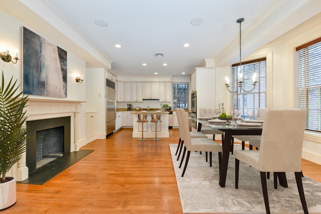 17 Willow Street, Unit 1 Boston, MA 02108 - Photo 33 of 35 a living room with furniture a fireplace and kitchen view