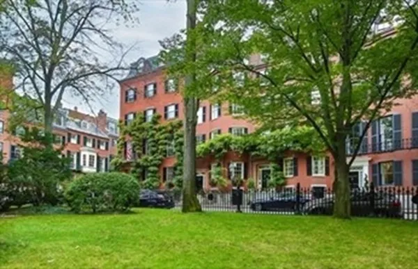 a front view of a building with garden