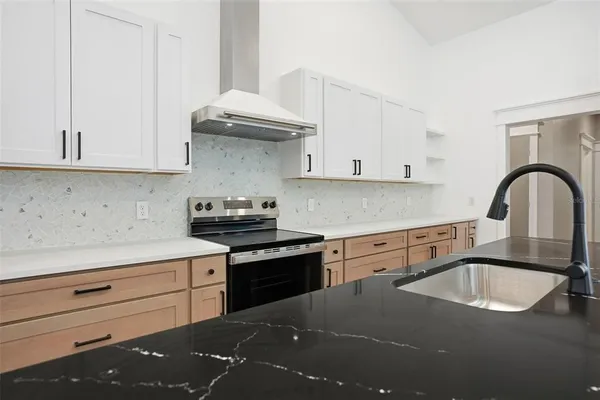 an aerial view of a house with wooden floor