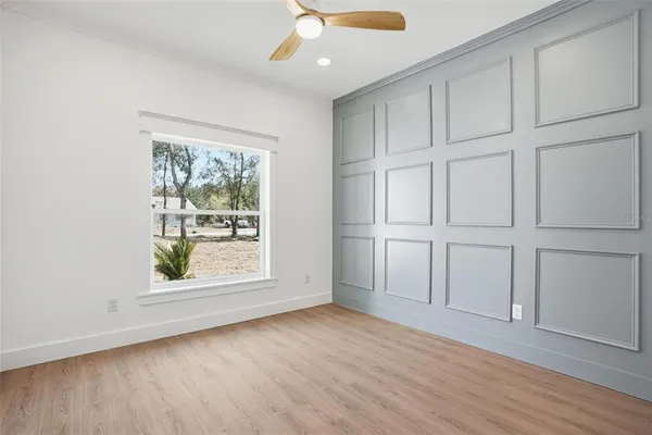 an aerial view of a house with a yard and lake view