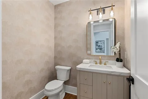 a bedroom with a bed a window and a chandelier