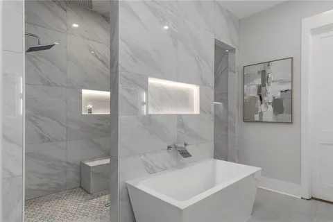 a view of a hallway with wooden floor and stairs