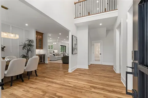 a living room with furniture a window and gym equipment