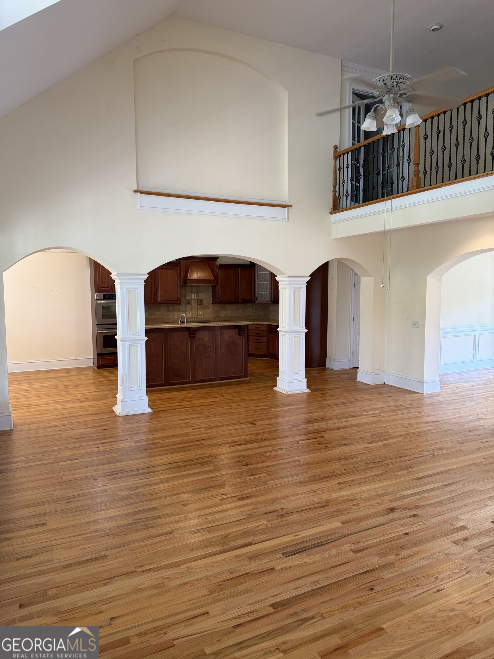 302 Norris Road Barnesville, GA 30204 - Photo 21 of 65 a view of empty room with wooden floor