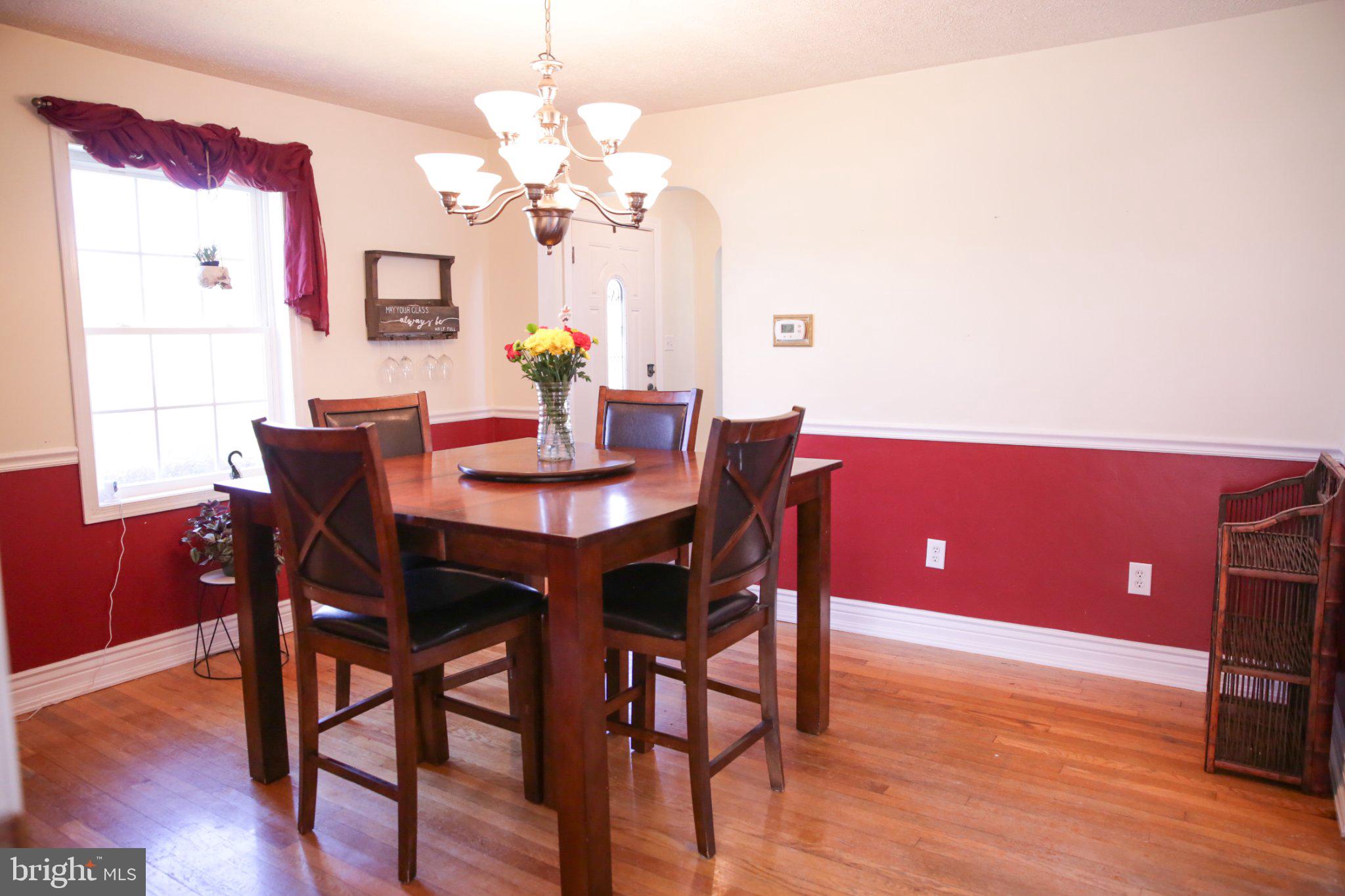 174 Armstrong Street Romney, WV 26757 - Photo 13 of 28 Charming dining space with warm hues.