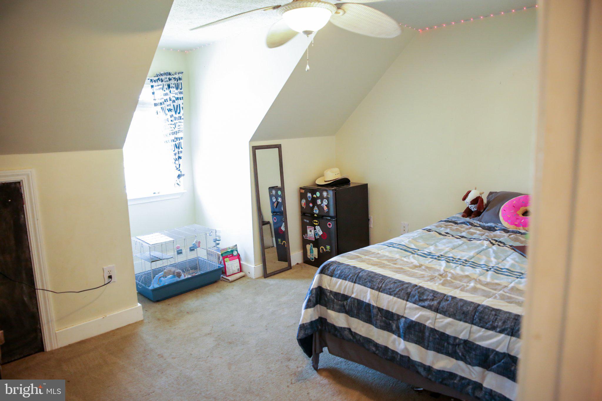 174 Armstrong Street Romney, WV 26757 - Photo 19 of 28 Cozy attic retreat with natural light.