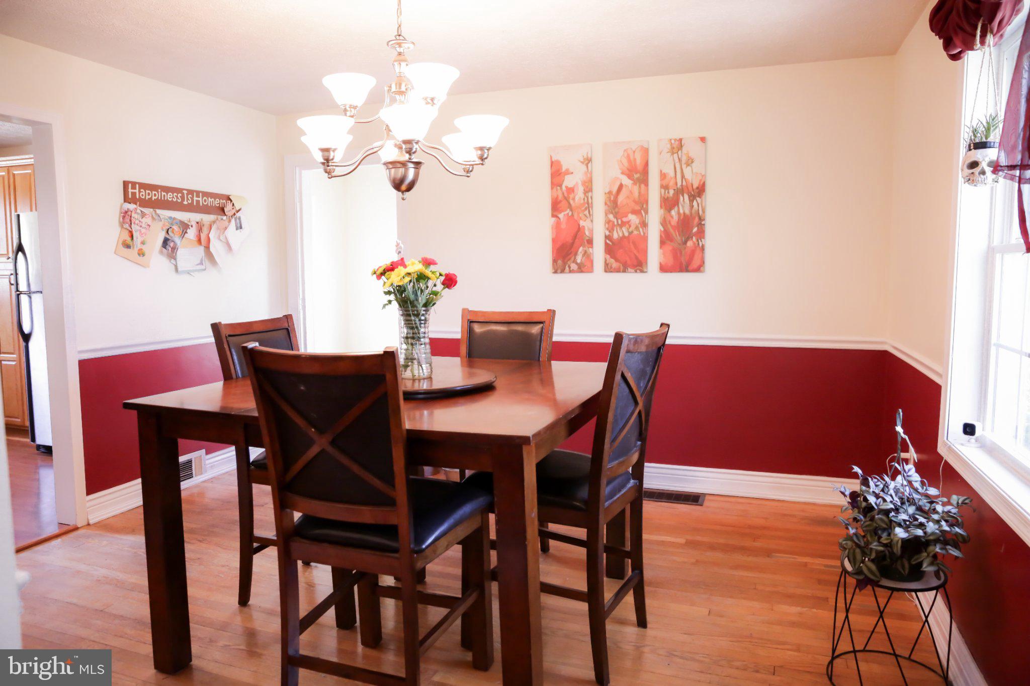 174 Armstrong Street Romney, WV 26757 - Photo 4 of 28 Charming dining space with vibrant decor.