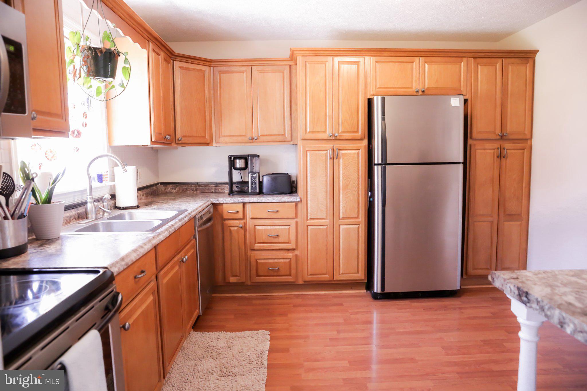 174 Armstrong Street Romney, WV 26757 - Photo 6 of 28 Modern kitchen with warm wood tones.