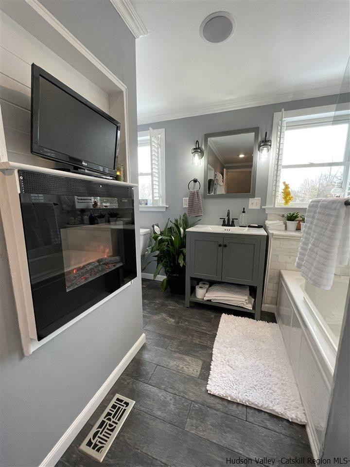 434 Cottekill Road Kingston, NY 12401 - Photo 12 of 35 a living room with a fireplace furniture and a flat screen tv