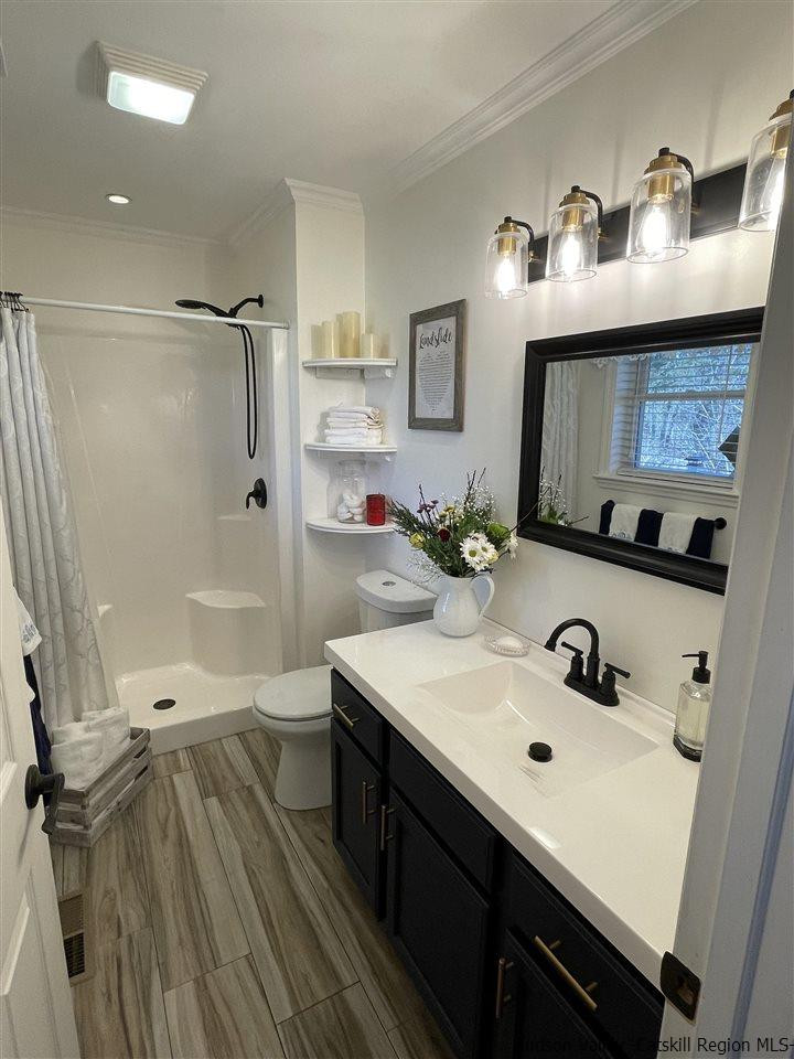 434 Cottekill Road Kingston, NY 12401 - Photo 21 of 35 a bathroom with a sink mirror toilet and shower