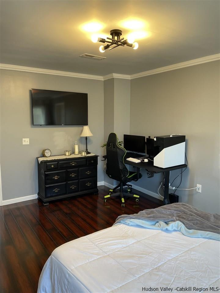 434 Cottekill Road Kingston, NY 12401 - Photo 23 of 35 a bedroom with furniture and a wooden floor