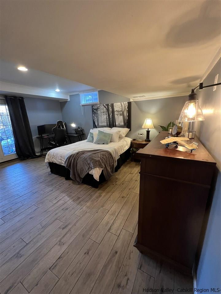 434 Cottekill Road Kingston, NY 12401 - Photo 25 of 35 a bedroom with bed and wooden floor