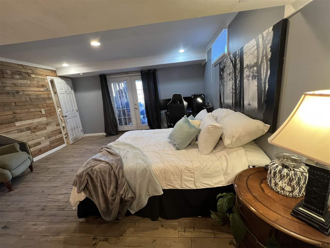 434 Cottekill Road Kingston, NY 12401 - Photo 26 of 35 a bed sitting in a bedroom and chair