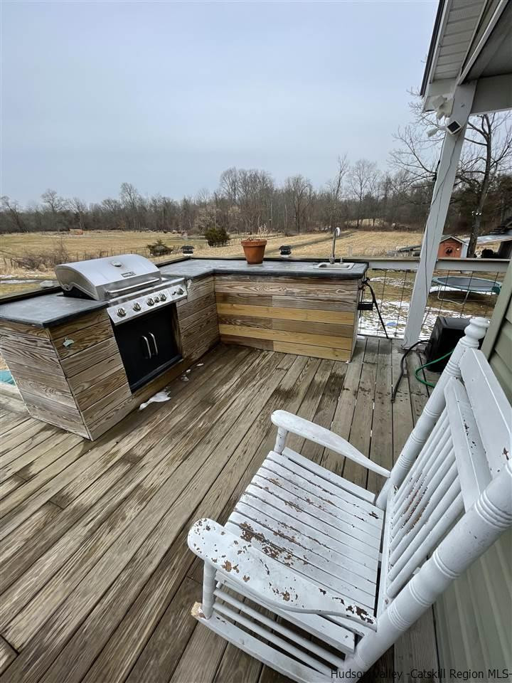 434 Cottekill Road Kingston, NY 12401 - Photo 31 of 35 a view of a balcony with wooden floor and outdoor space