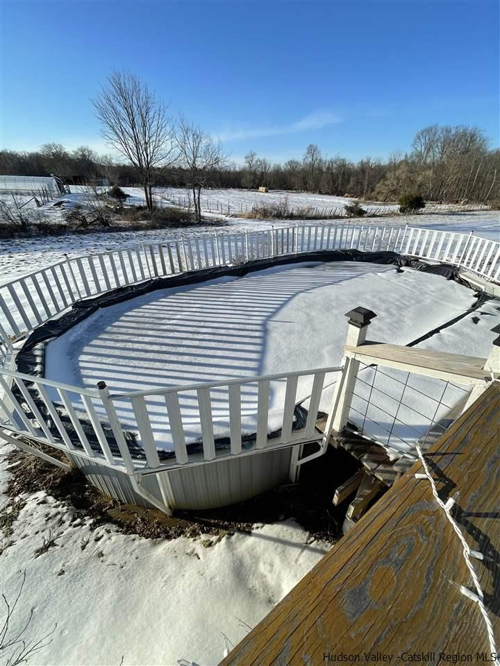 434 Cottekill Road Kingston, NY 12401 - Photo 33 of 35 a view of a balcony with two chairs and a table