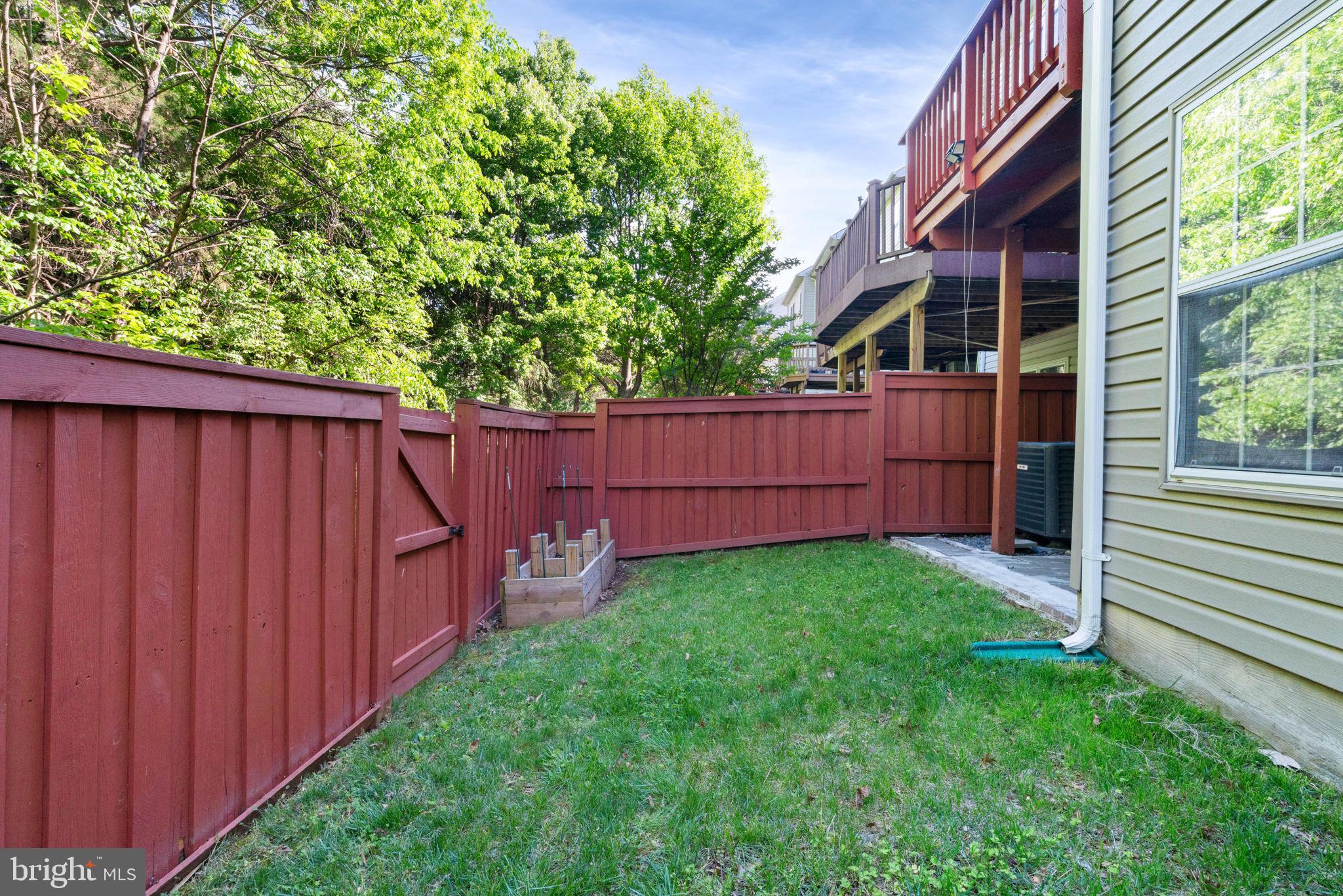 21654 Frame Square Broadlands, VA 20148 - Photo 41 of 43 Charming fenced yard with lush greenery.