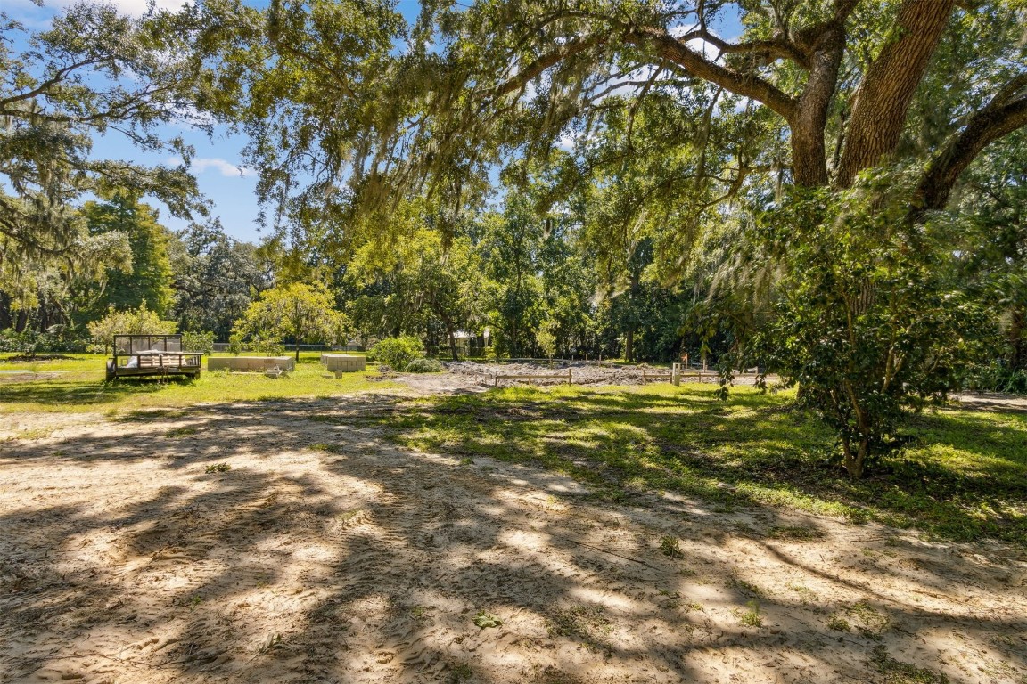 766 Adams Road Fernandina Beach, FL 32034 - Photo 18 of 31 a view of outdoor space with deck and yard