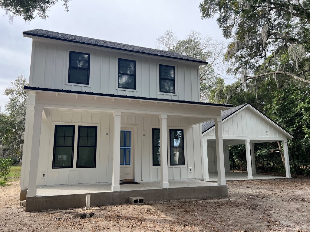 766 Adams Road Fernandina Beach, FL 32034 - Photo 2 of 31 a front view of a house with a garden